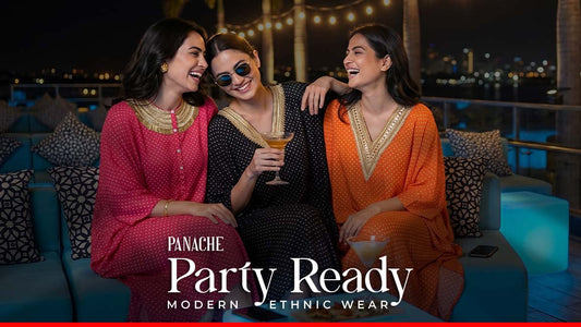 Three women enjoying the cocktail party in designer outfits