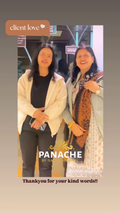A girl with her mother smiling standing together talking about Panache store