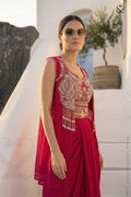 Woman in a Red and white heavy embroidered crop top blouse and shrug with matching skirt branding Panache Premium designer Lehenga Store