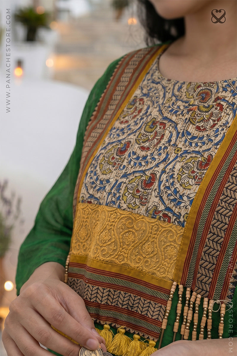 Traditional embroidered garment with intricate patterns on a blurred background