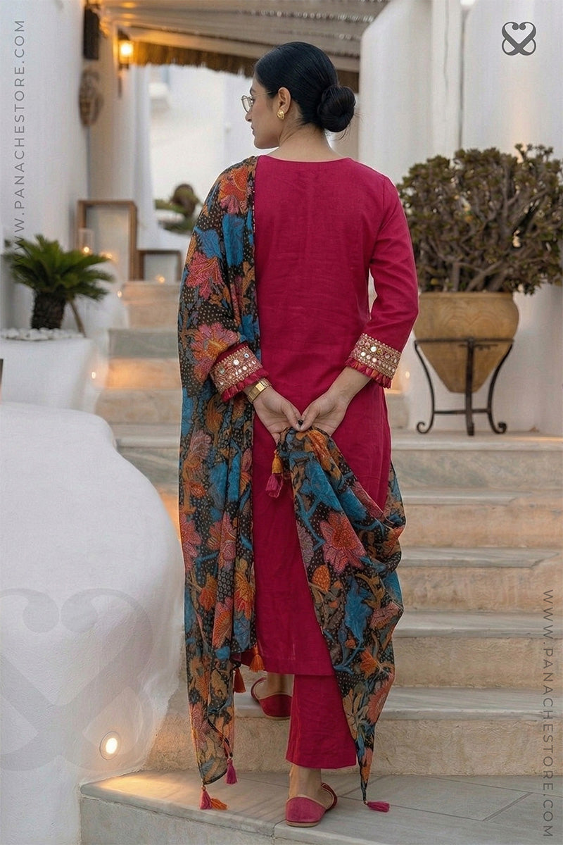 Woman in a red-pink kurti outfit with sequin embellishments on sleeves and floral print dupatta back pose