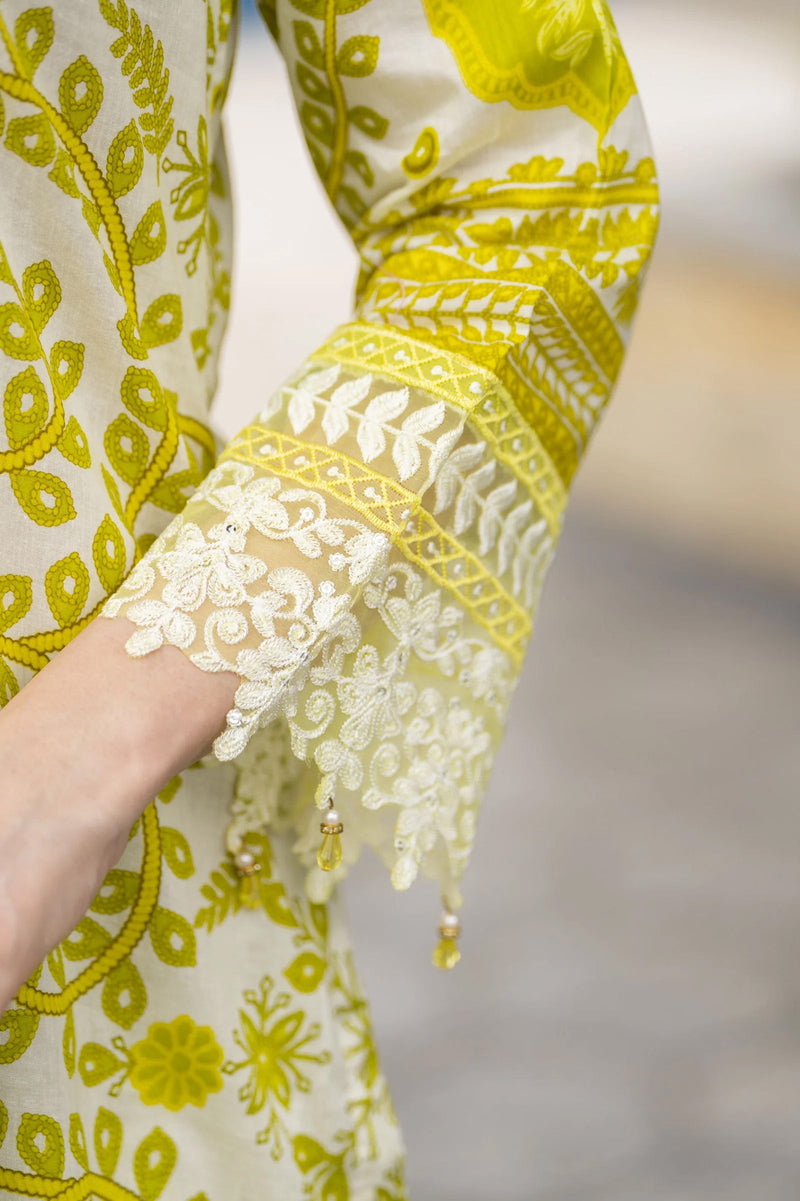 Close-up of a garment with yellow and white floral patterns