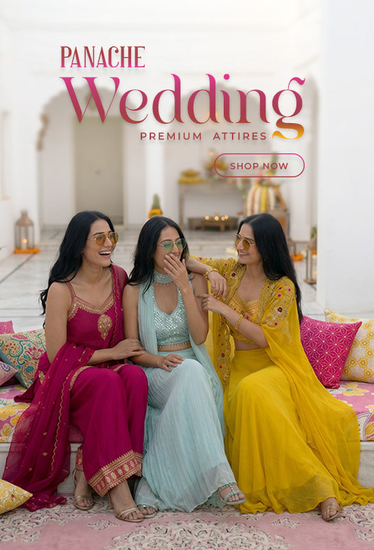 Three women in colorful designer wedding outfits sitting on a couch with 'Panache Wedding' advertisement.