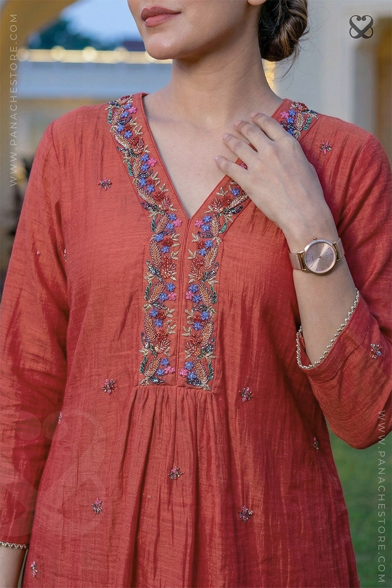 Red kurti with floral multi color embroidery on neckline and small motifs